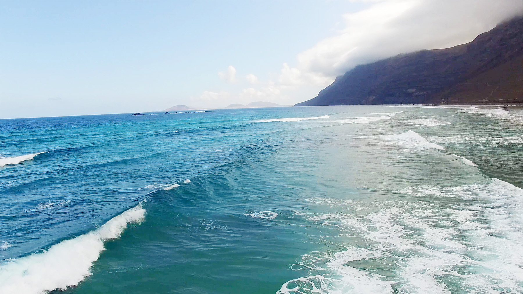 Surfable waves in the track section of Famara Beach